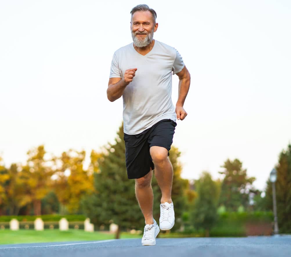 Older man running outside